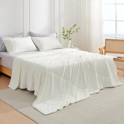 Cozy Bliss cooling comforter spread over a bed for summer sleep