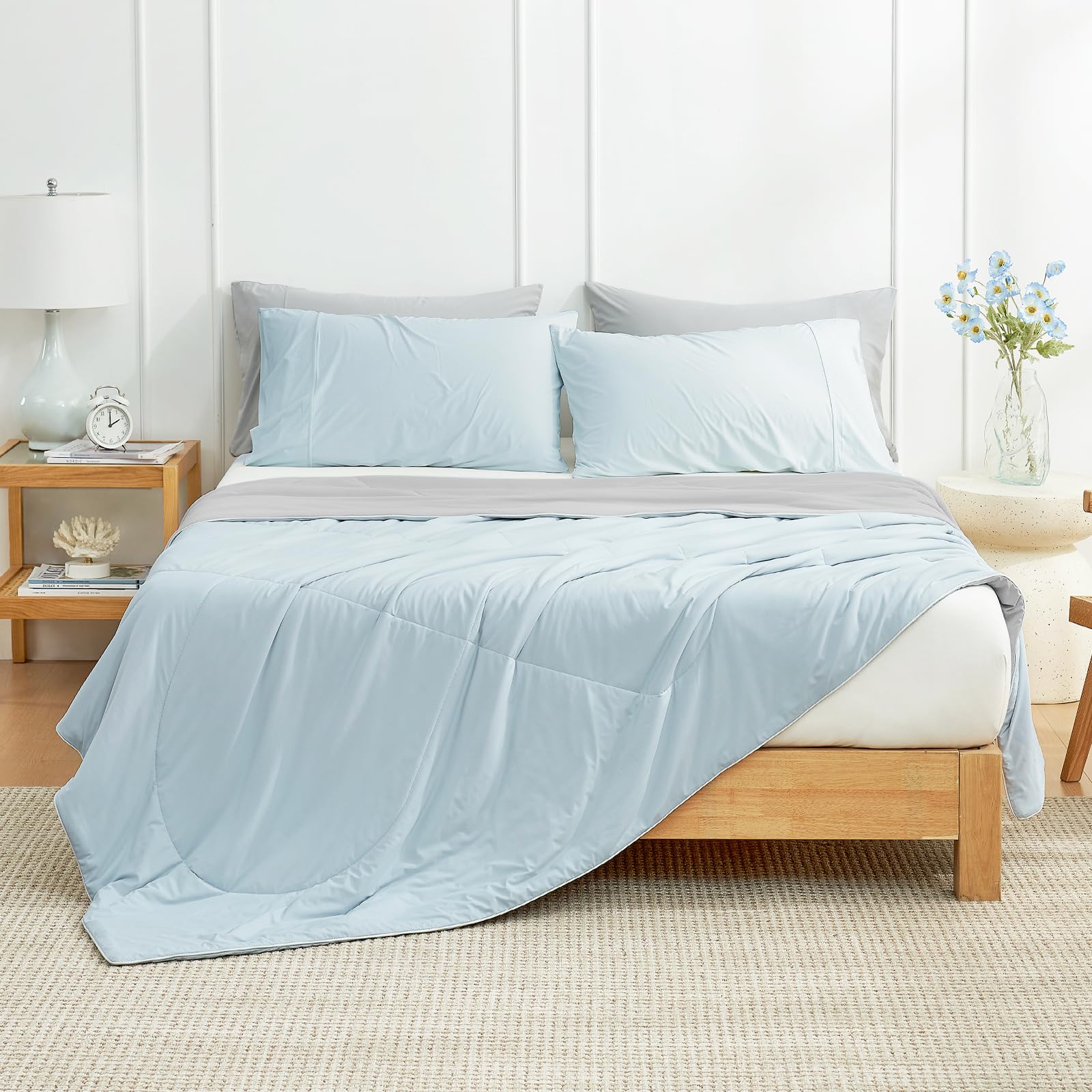 Cozy Bliss cooling comforter queen spread on bed, airy and cooling for warm nights.