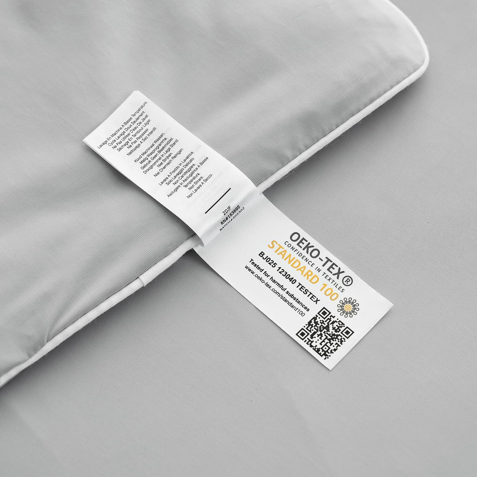 Stitching along the edge indicates durable construction and easy care of the comforter.