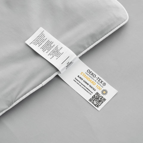 Stitching along the edge indicates durable construction and easy care of the comforter.