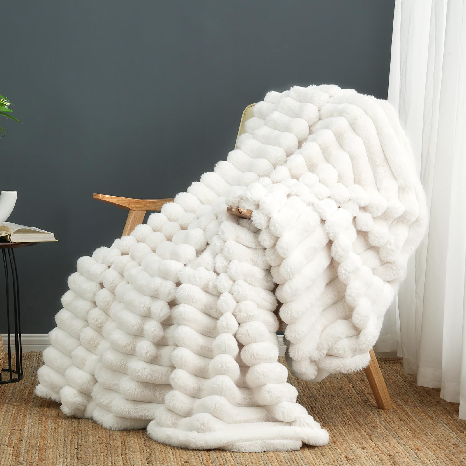 Cozy Bliss faux fur blanket on sofa adds warm, stylish texture.