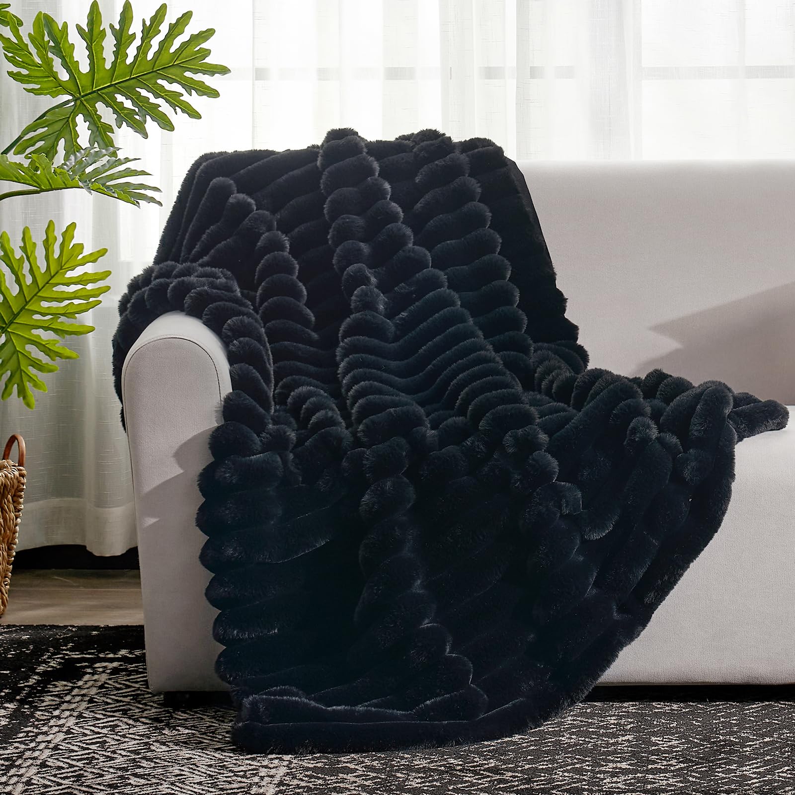 Cozy Bliss faux fur throw on sofa, perfect for cozy movie nights.