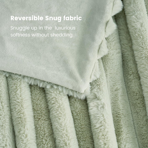 Cozy Bliss faux fur throw blanket in sage green complements calm spaces.