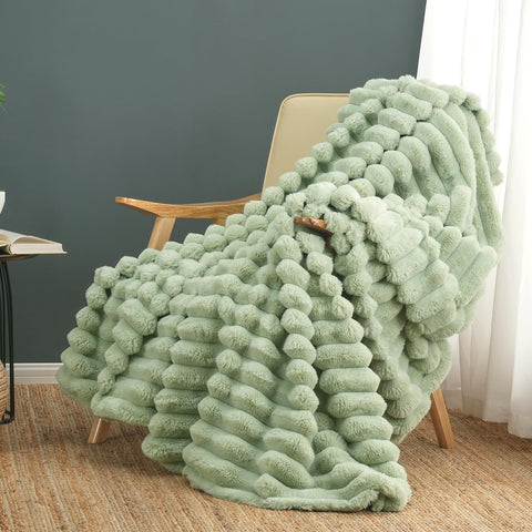 Cozy Bliss faux fur throw blanket draped over sofa for plush warmth and texture.