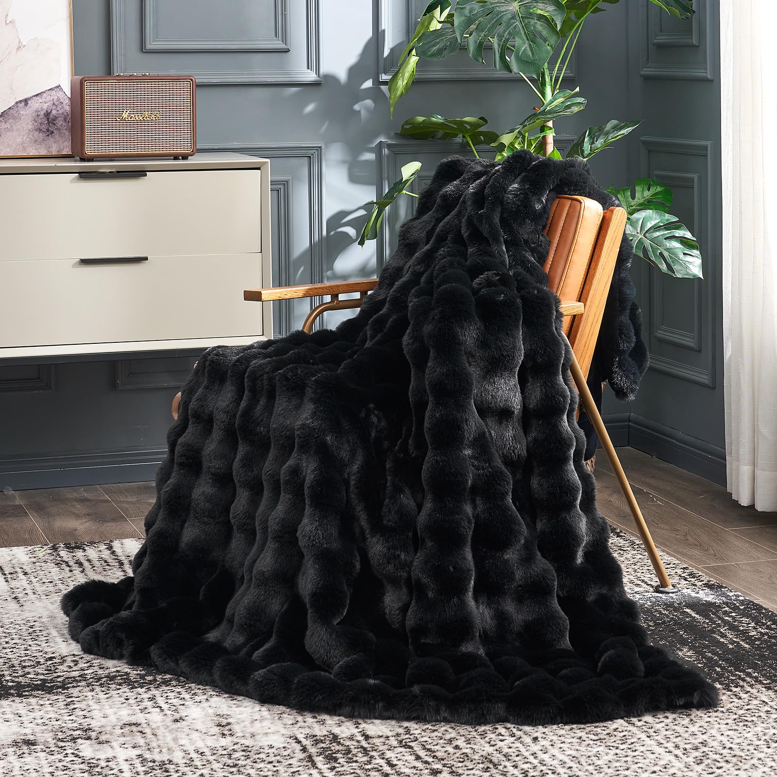 Cozy Bliss faux fur throw with bubble design adds stylish warmth to a sofa.