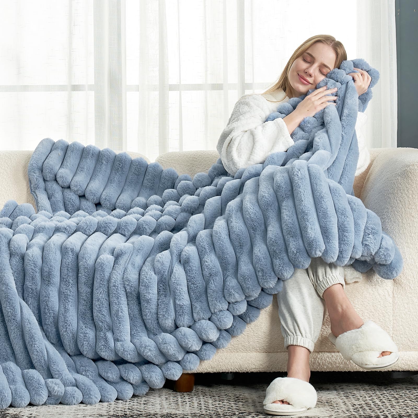 Cozy Bliss faux fur throw folded on sofa adds warmth and style