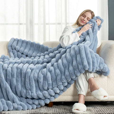 Cozy Bliss faux fur throw folded on sofa adds warmth and style