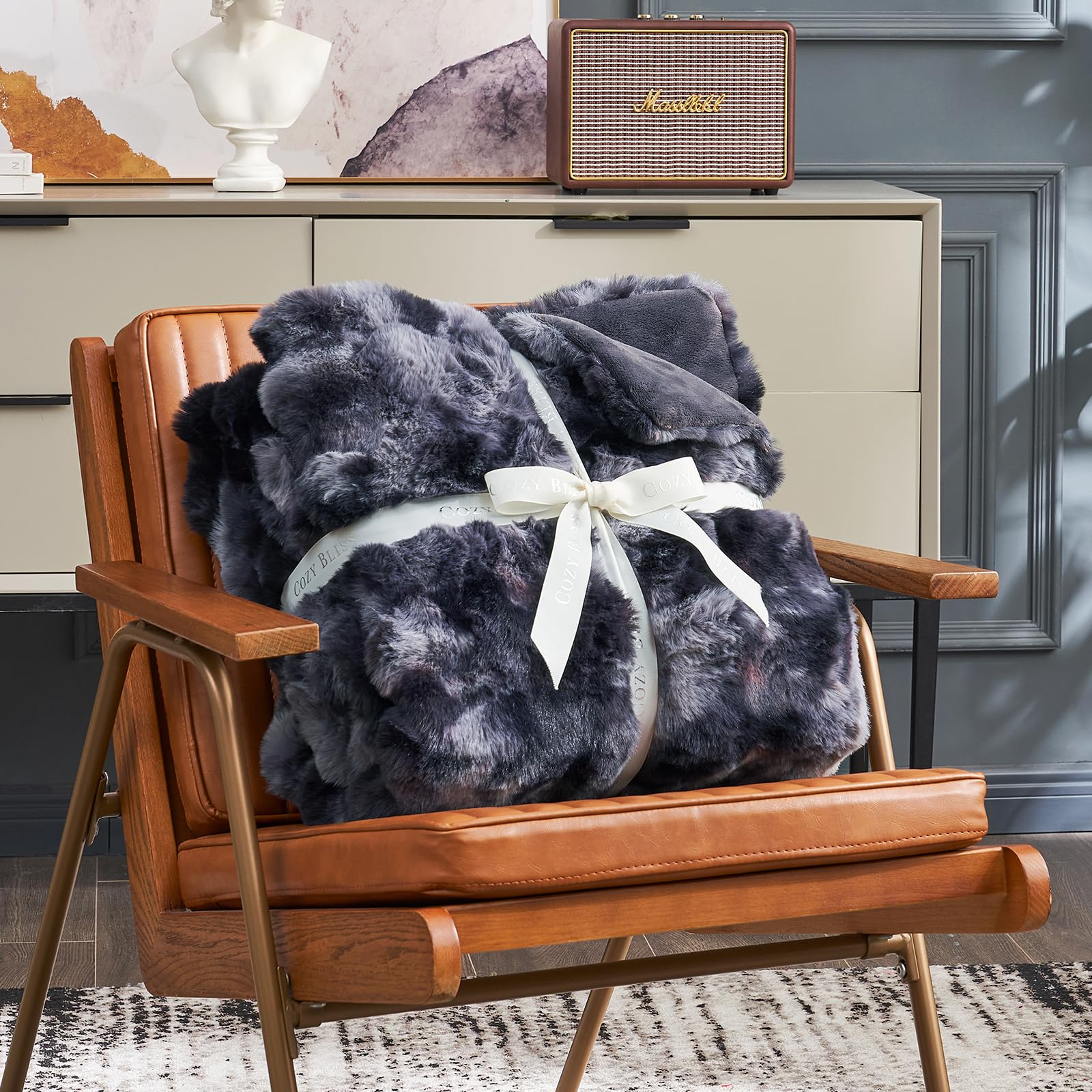 Cozy Bliss faux fur throw interior micromink fabric delivers silky softness.