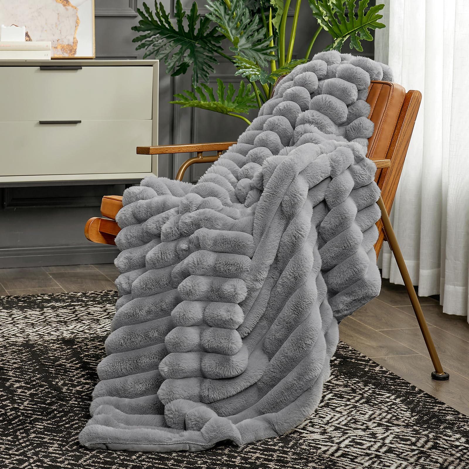 Cozy Bliss faux fur throw on chair enhances plush decor