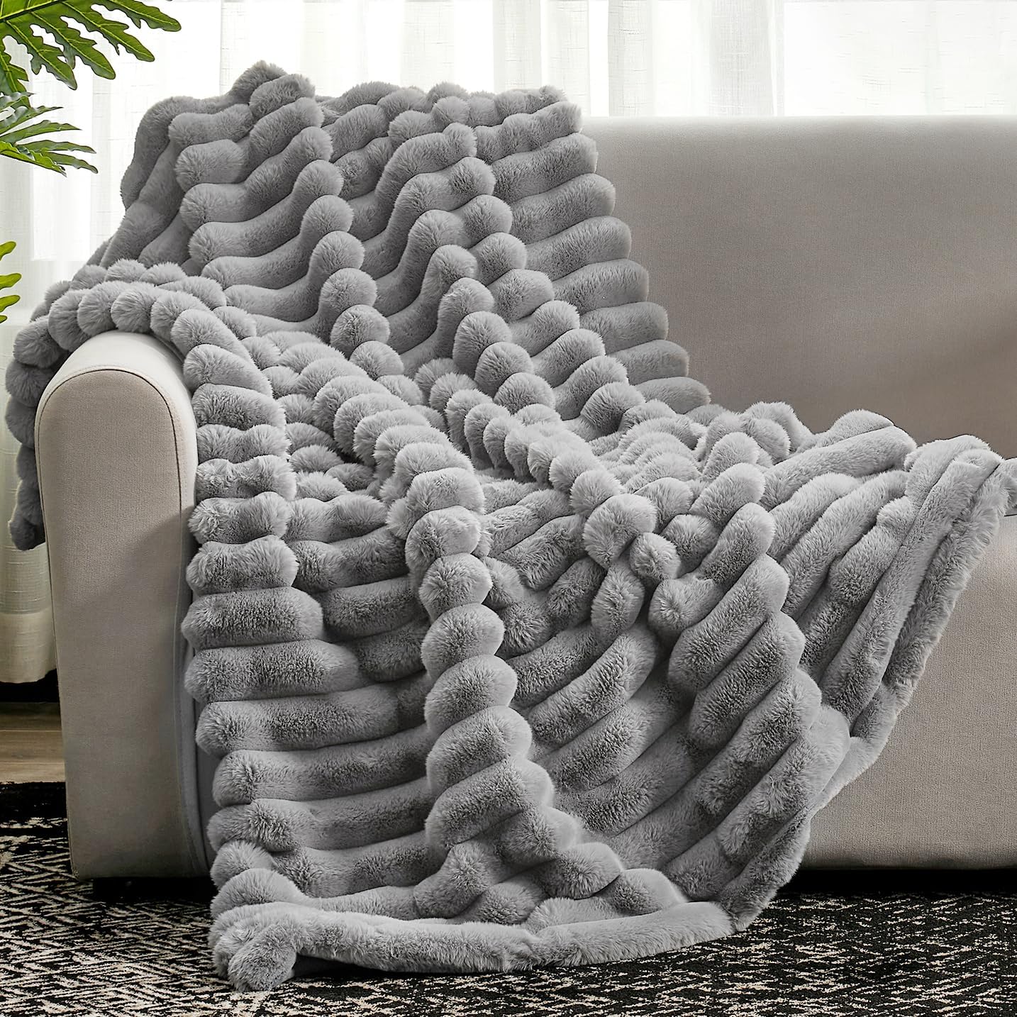 Cozy Bliss faux fur throw on couch for warm, inviting texture