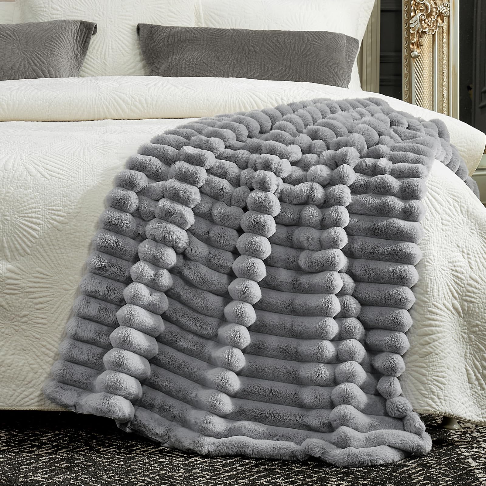 Cozy Bliss faux fur throw draped over armchair for cozy comfort