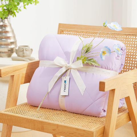 Cozy Bliss lightweight blanket draped over bed for summer comfort