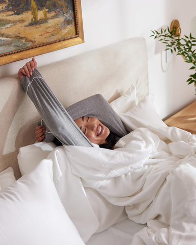 Cozy Earth bed sheets on a neatly made bed showing luxurious drape.