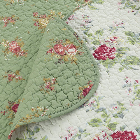 Cozy Line Blossom throw displayed on sofa for all-season coziness.