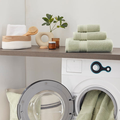 COZYART towel edge shows durable double-stitched hem detail.