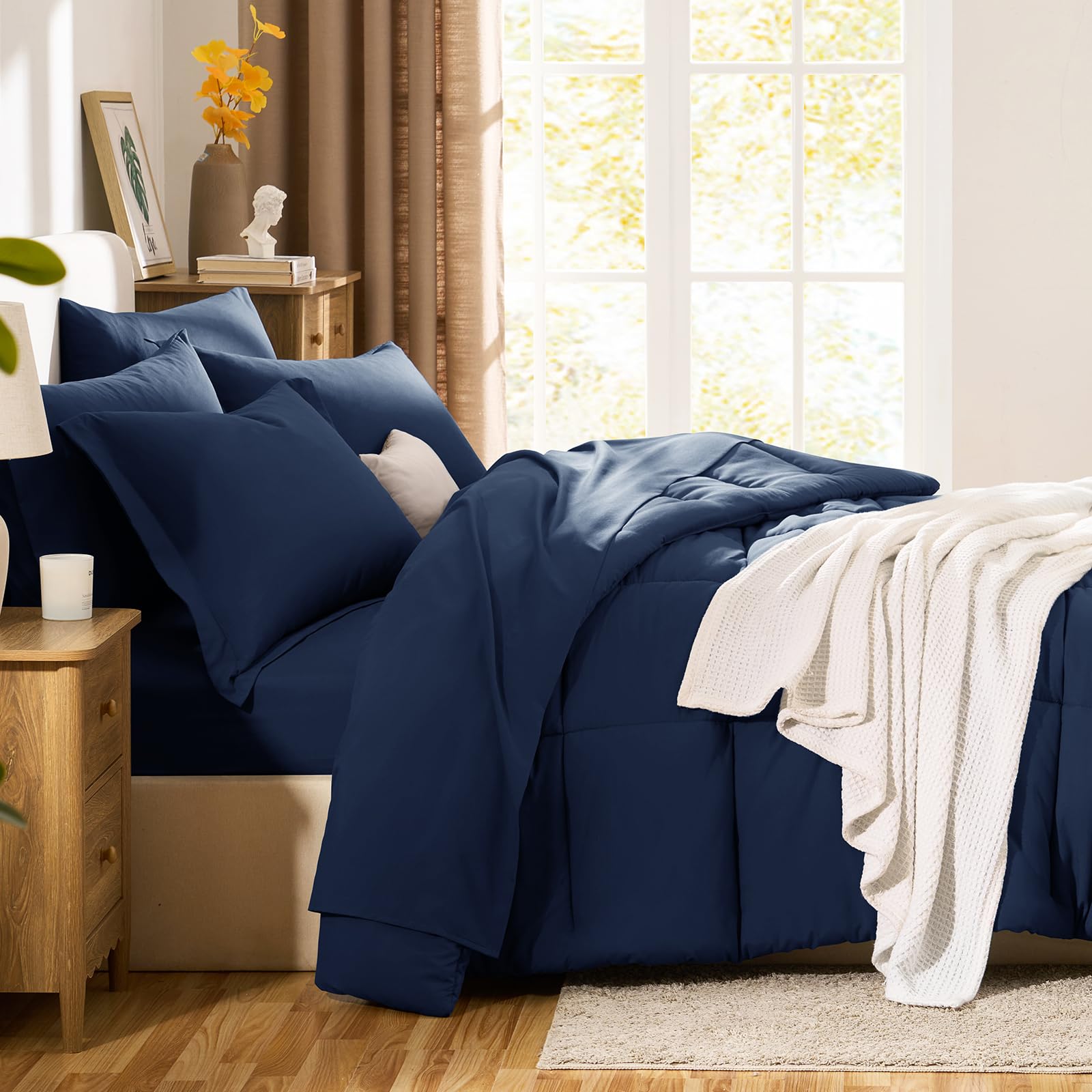 All-season microfiber CozyLux navy bedding shown for year-round use