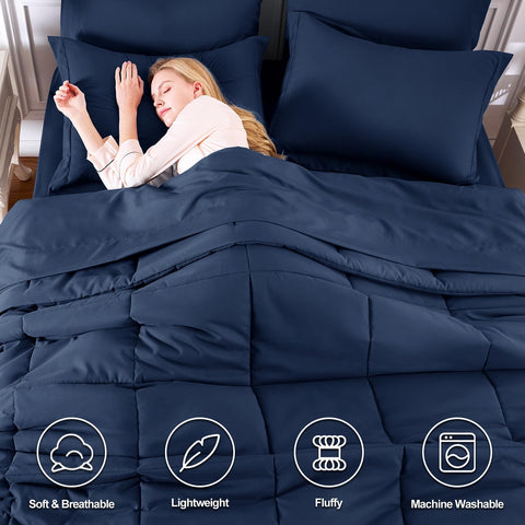 CozyLux navy bed-in-a-bag seven-piece set laid out together