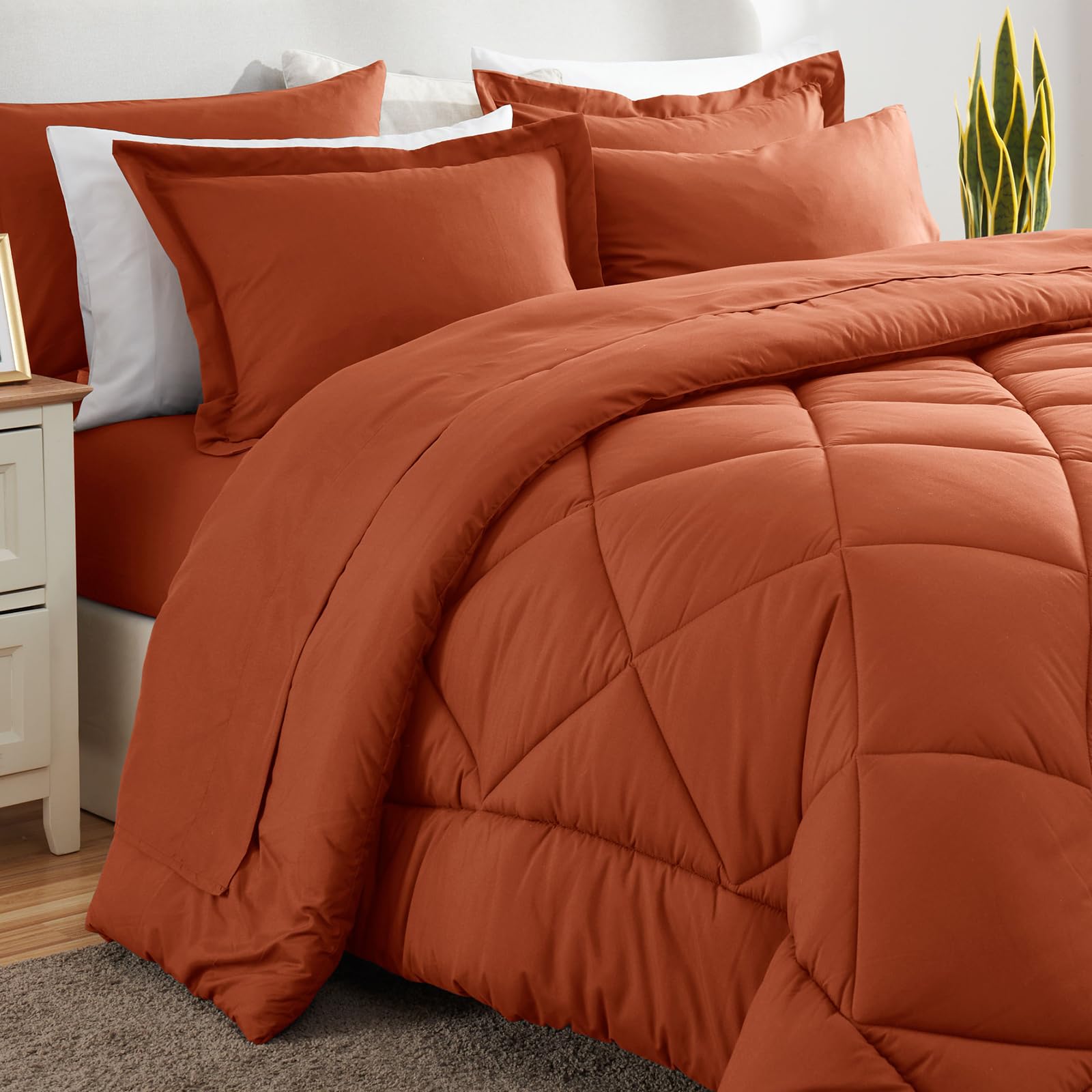 Terracotta bedroom scene demonstrates versatile styling with CozyLux bedding.