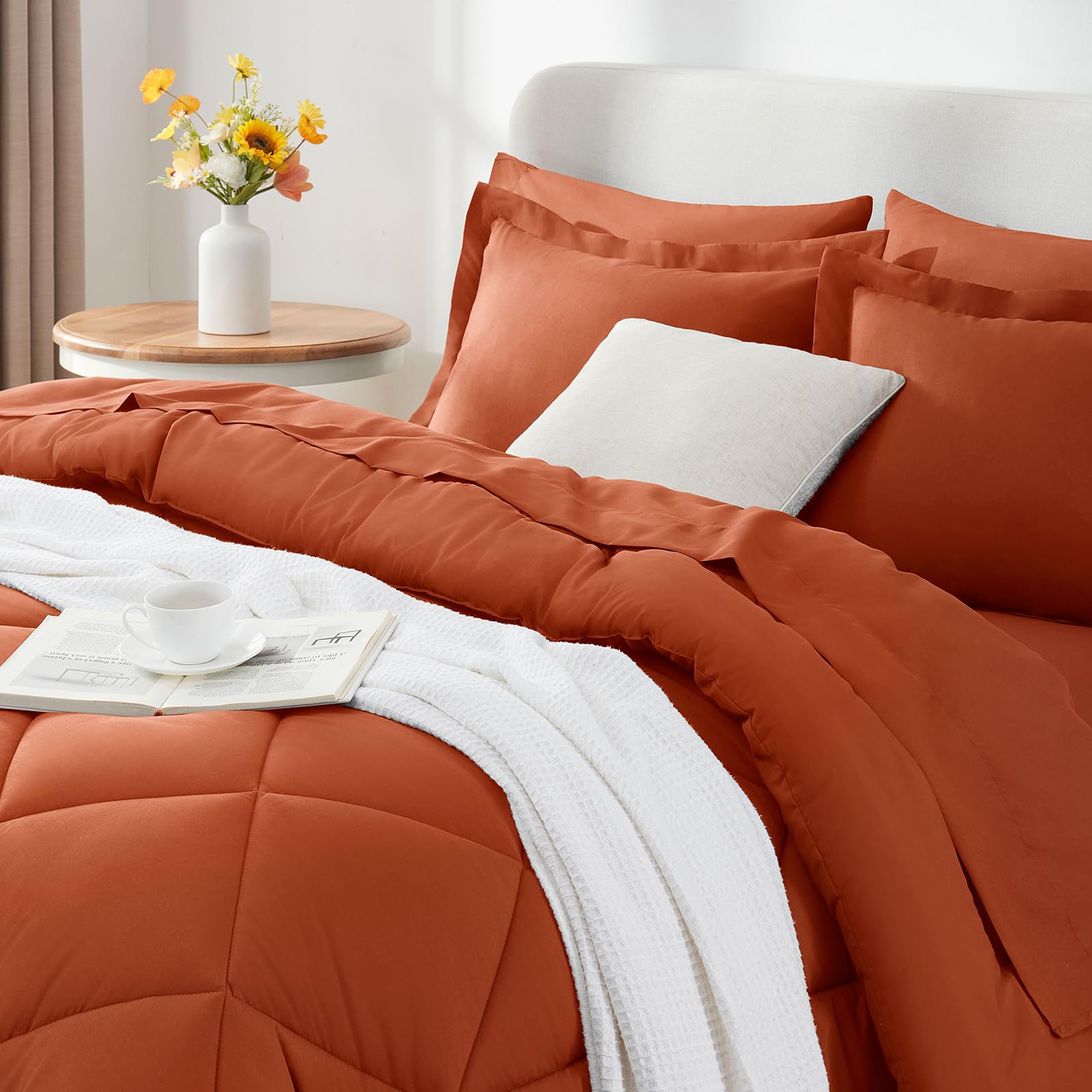 CozyLux bedroom styling with terracotta tones demonstrates versatile all-season aesthetic