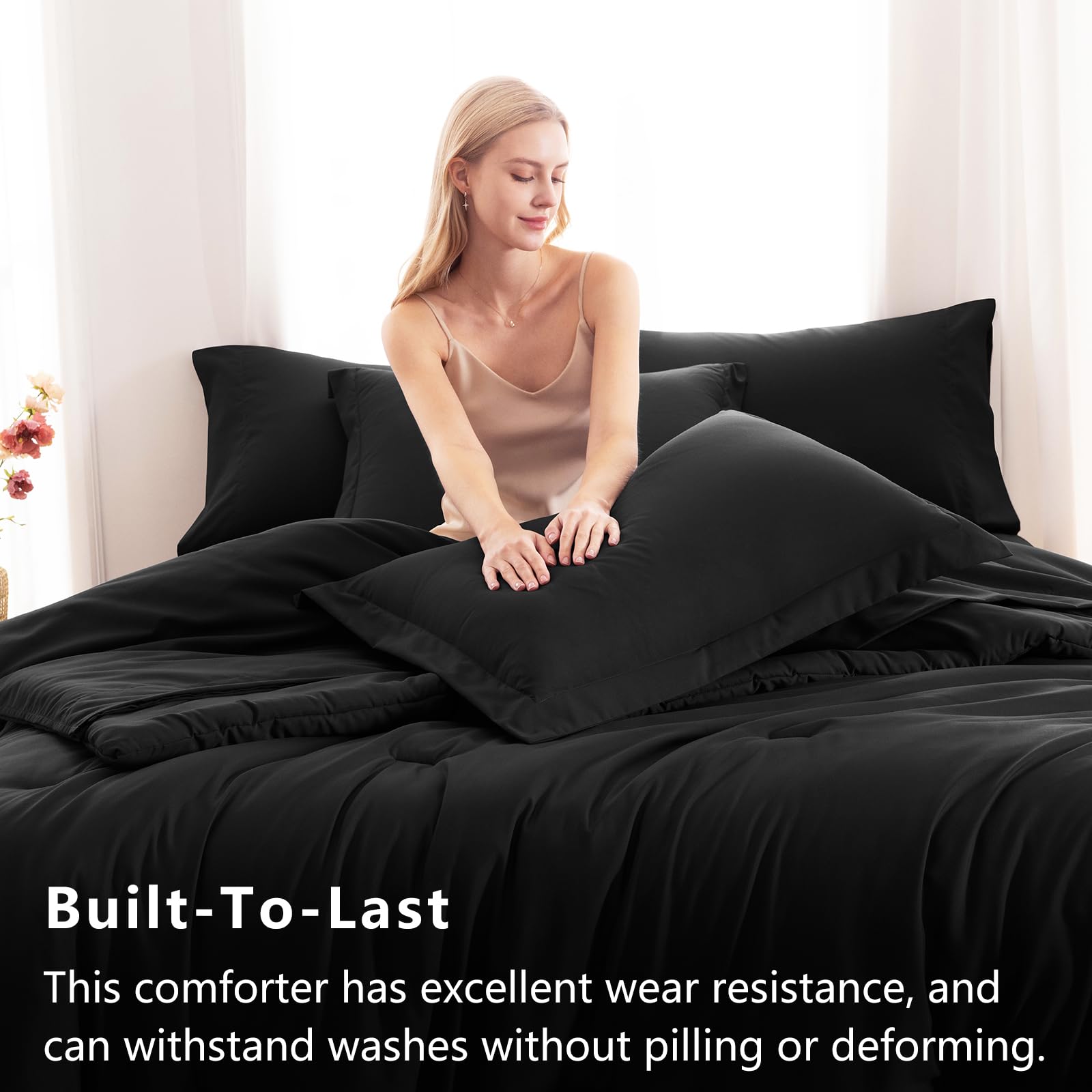 CozyLux fitted sheet in black ensures secure fit and easy care