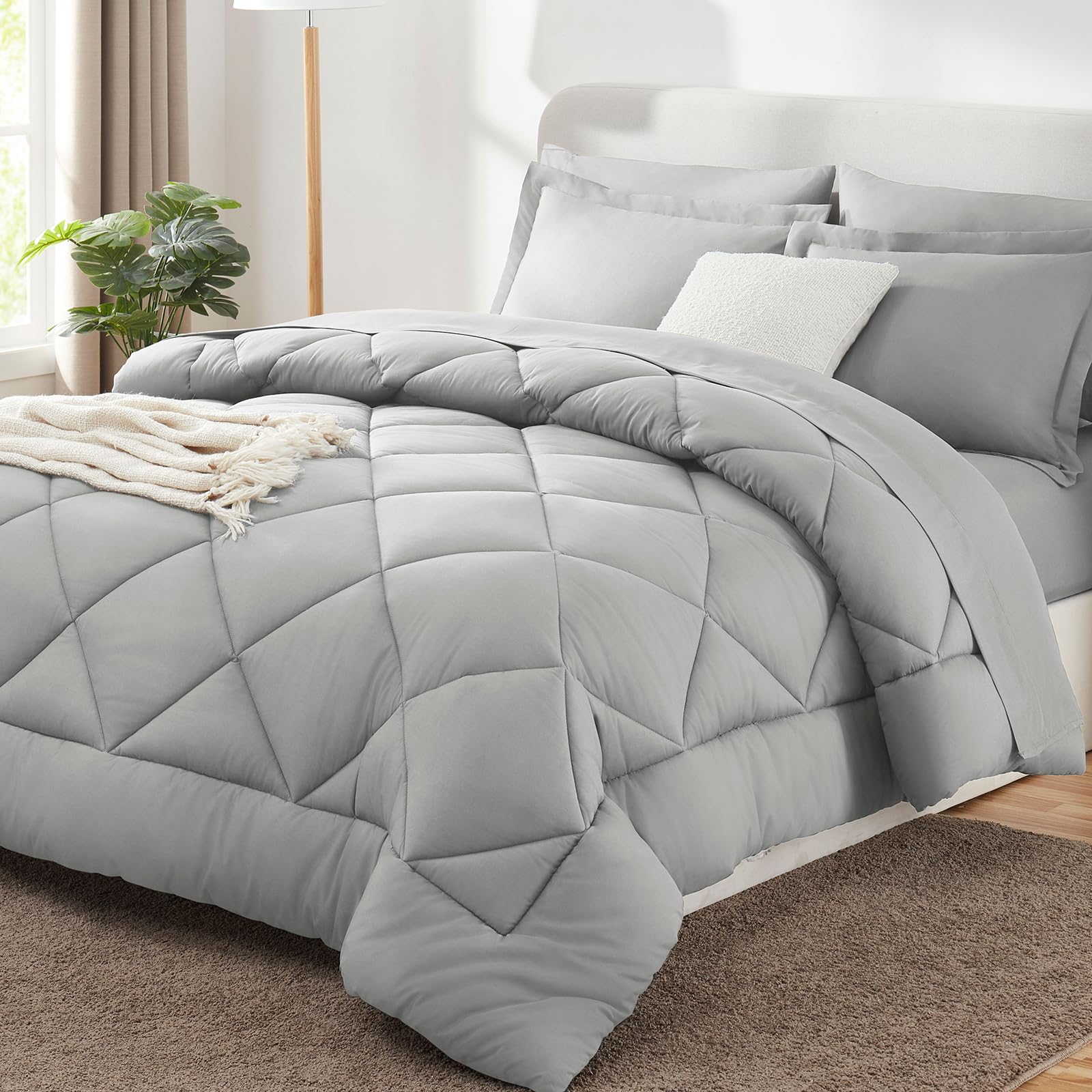 CozyLux full-size comforter set in light grey offers year-round comfort and bed-in-a-bag convenience.