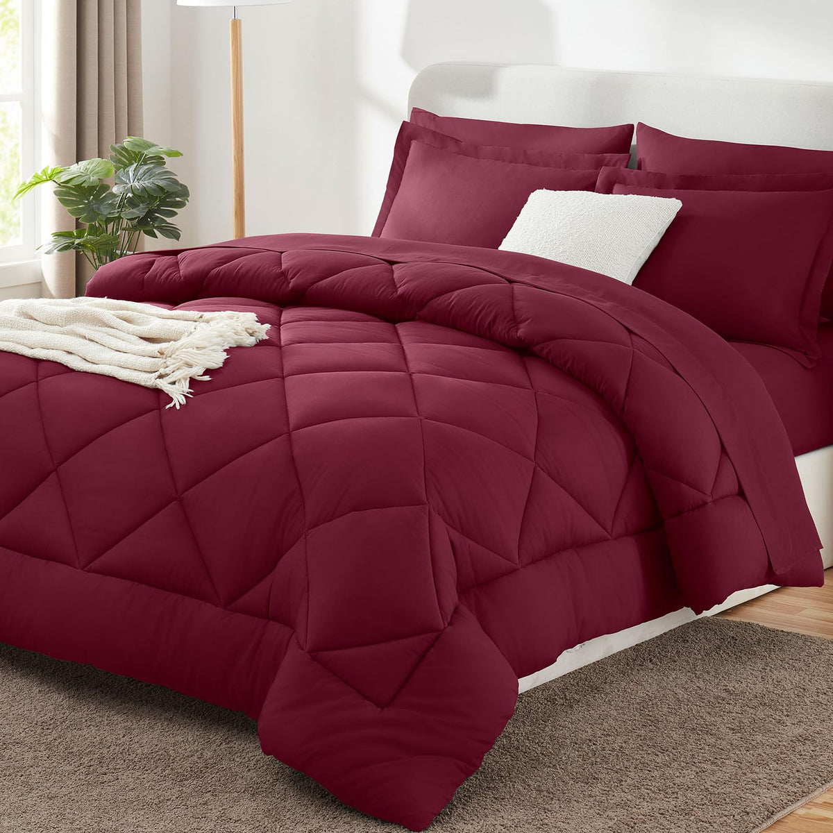 CozyLux king size burgundy comforter close-up shows plush microfiber and smooth stitching