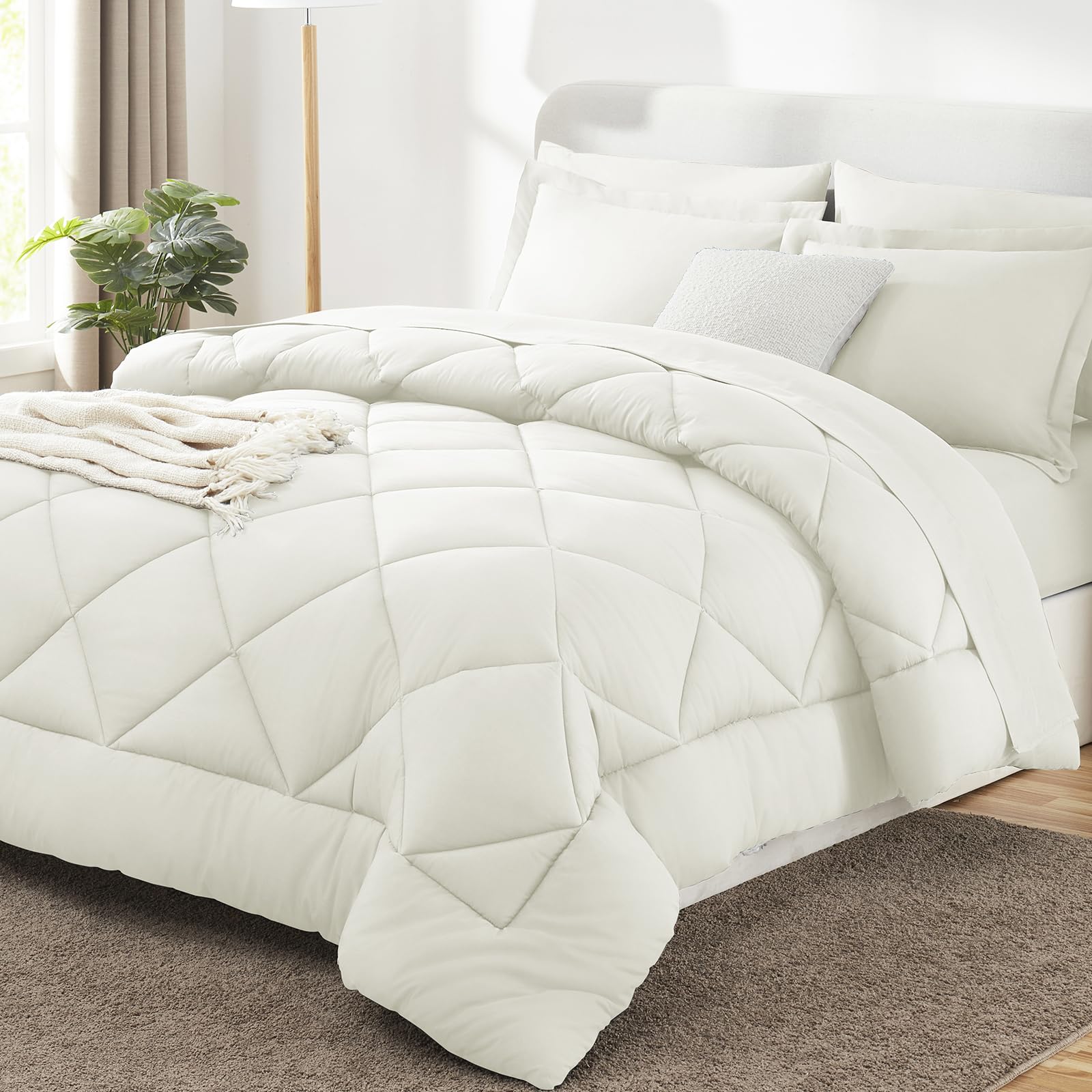 CozyLux king-size ivory comforter close-up showing plush, breathable warmth.