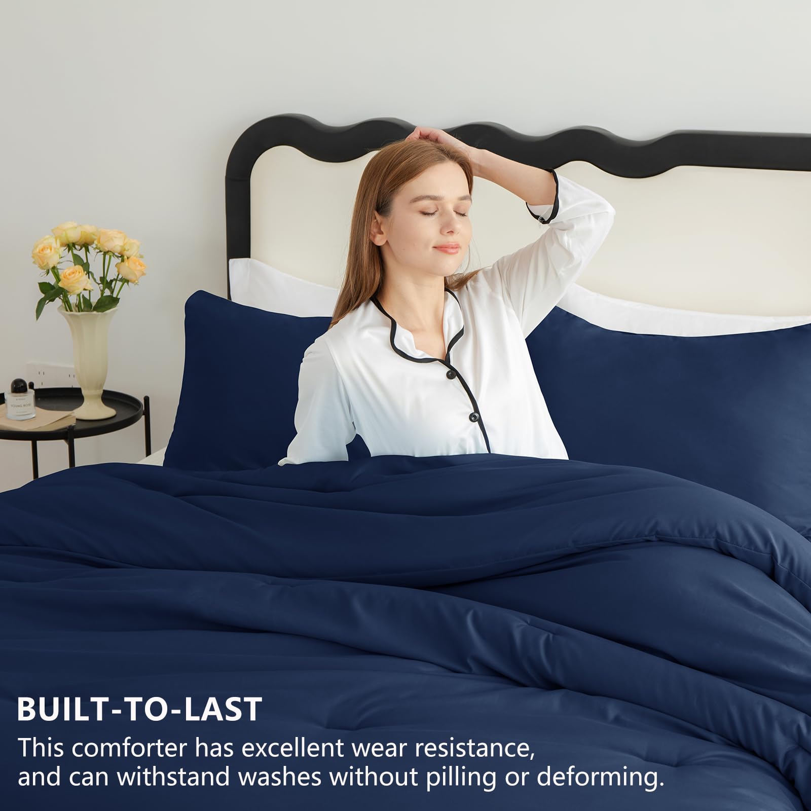 CozyLux navy blue comforter close-up reveals hidden stitching for durable fill.