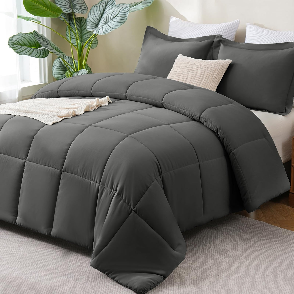 CozyLux queen comforter in dark grey packaging, highlighting easy care and ready warmth.