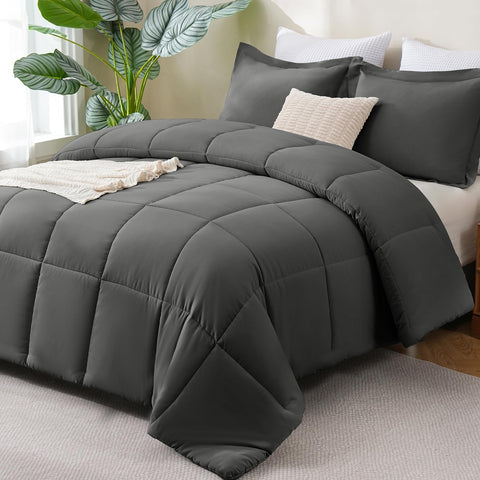 CozyLux queen comforter in dark grey packaging, highlighting easy care and ready warmth.