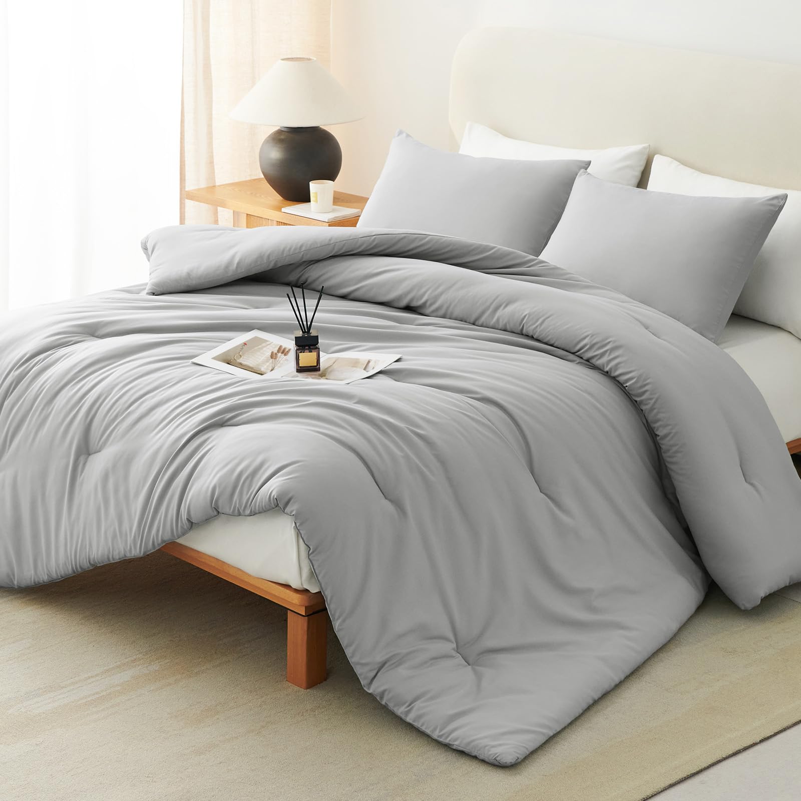CozyLux Queen Comforter light grey fabric close-up emphasizes softness and breathable microfiber.