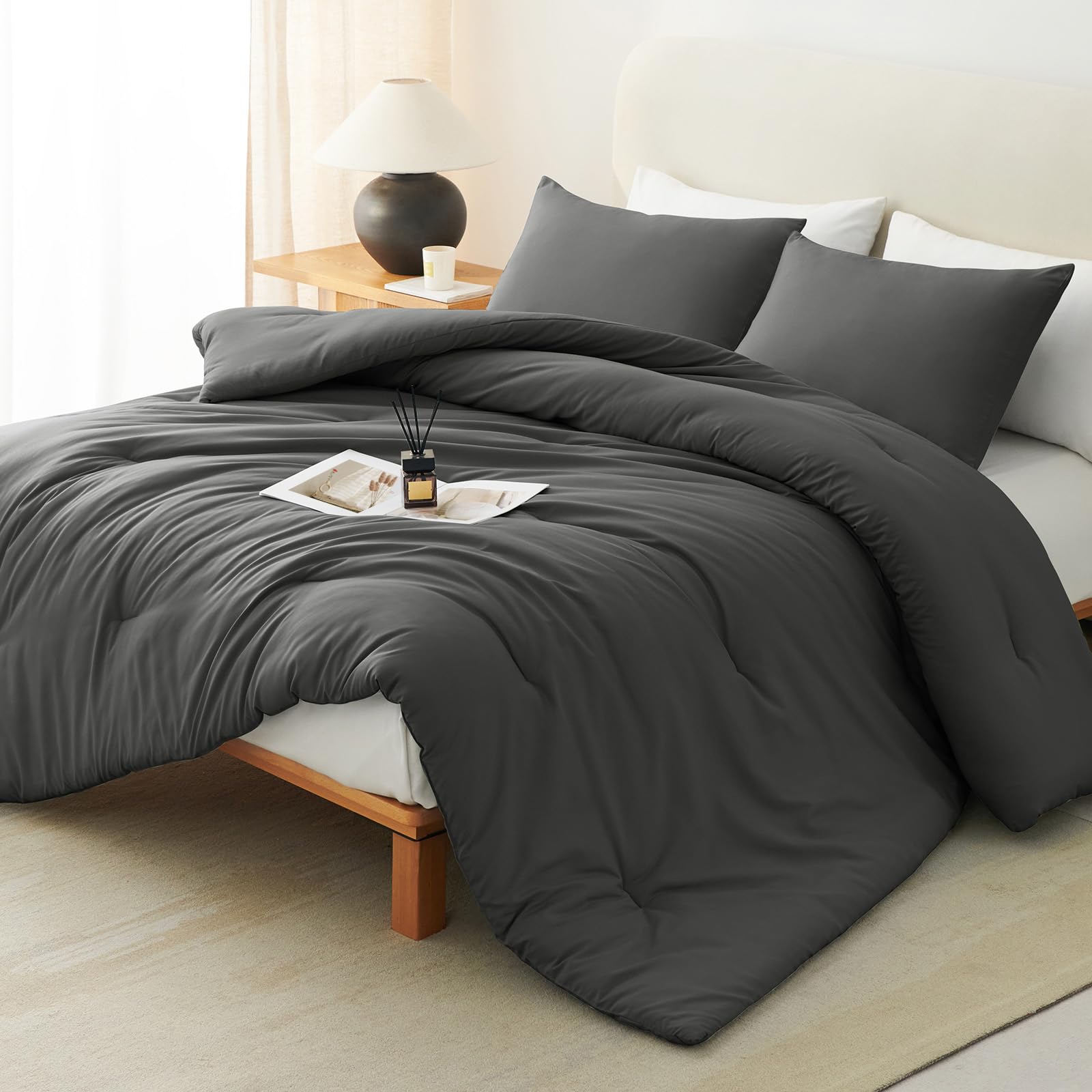 CozyLux queen comforter set in dark grey folded on bed for a cozy look