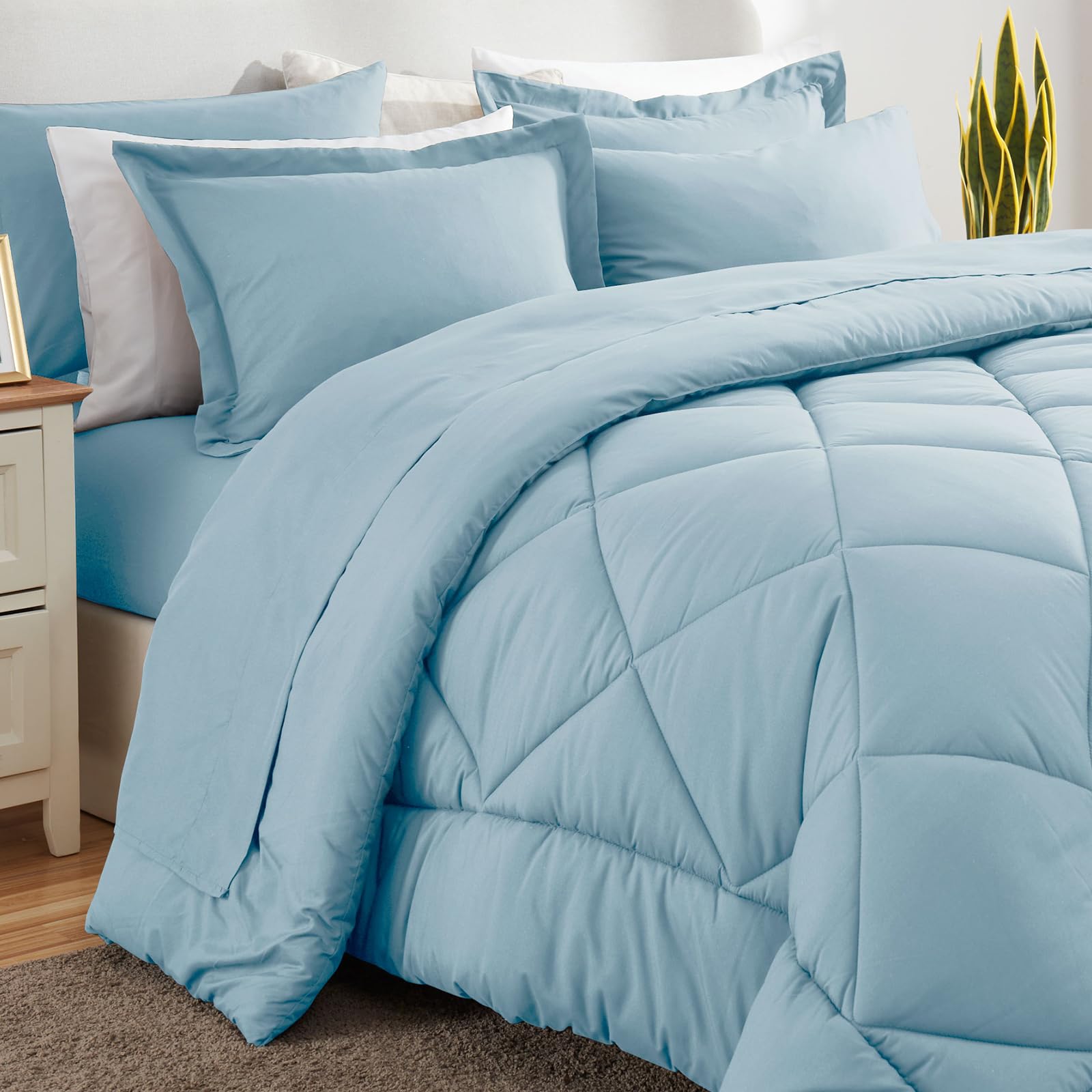 CozyLux Queen Comforter Set light blue pillows on bed illustrate inviting comfort.