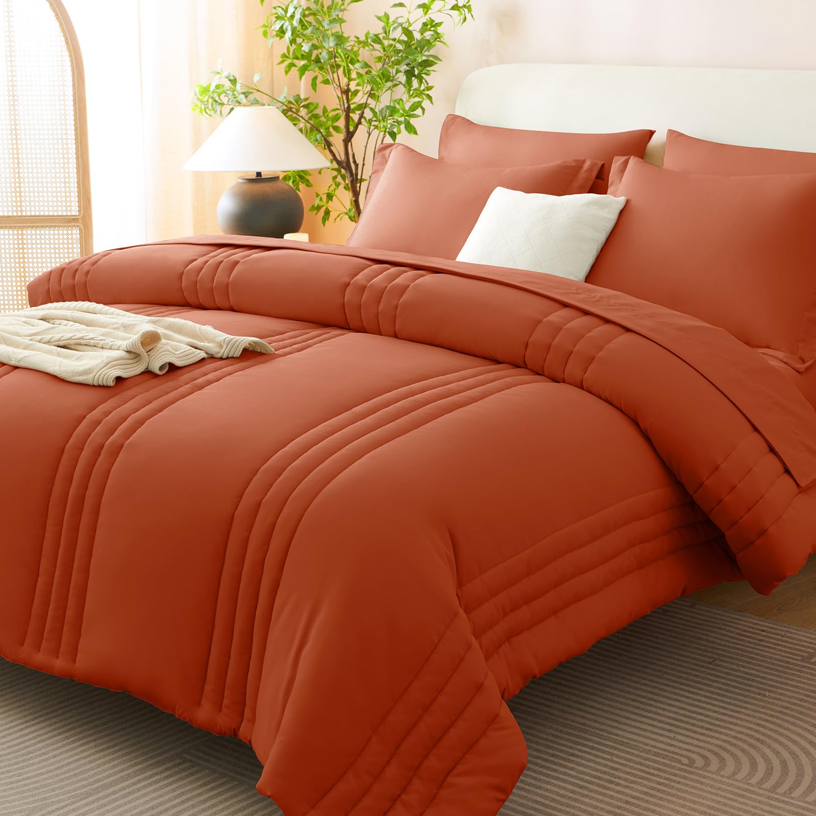 CozyLux terracotta comforter close-up showing breathable microfiber for year-round comfort.