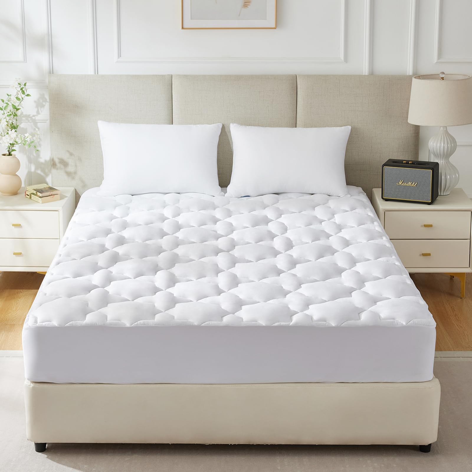 CozyLux mattress pad in use on bed with smooth top layer