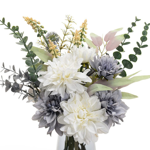 COZZI CODI silk flowers in vase boost cozy boho vibes in bedrooms.
