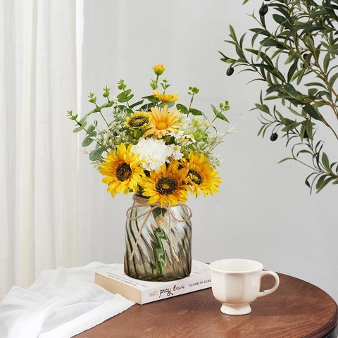 COZZI CODI arrangement with daisies and eucalyptus accents