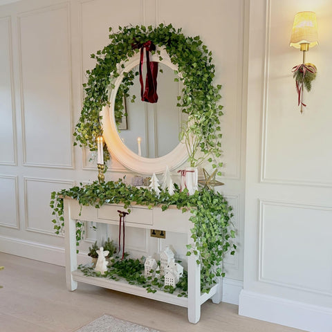 CQURE hanging ivy garland pairs well with lights, frames, and doors.