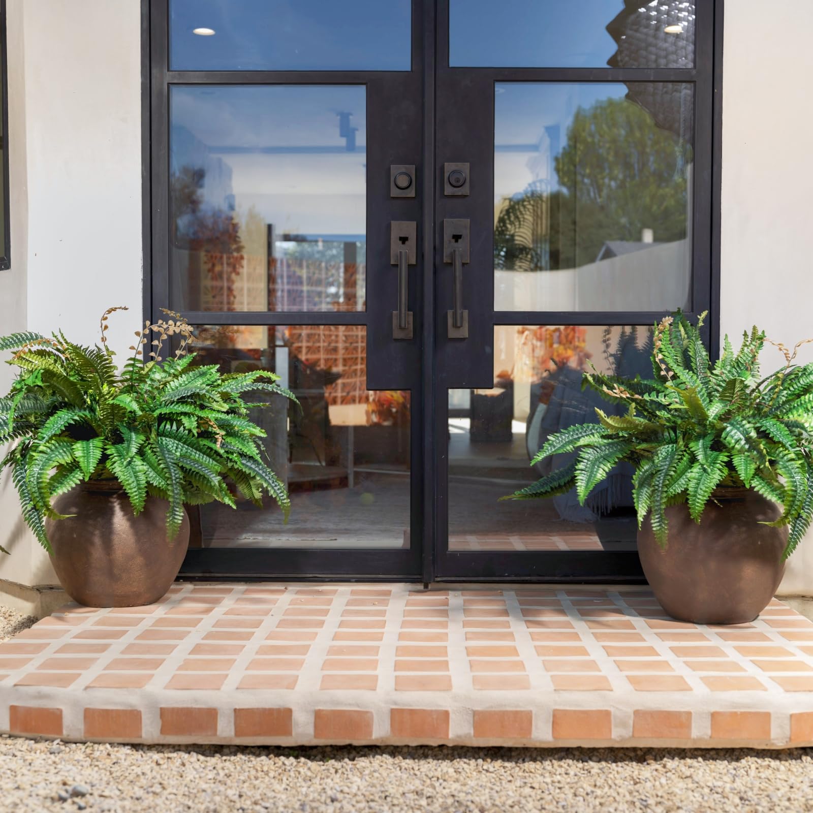 Large artificial Boston fern with 27-inch stems and adjustable branches for versatile decor.