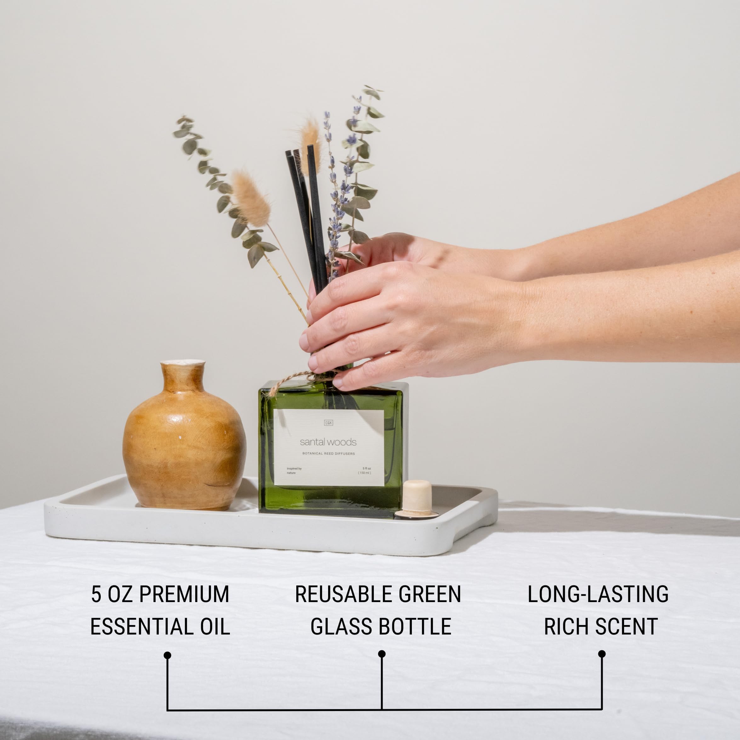 Craft and Kin green glass diffuser showcases elegant home fragrance.
