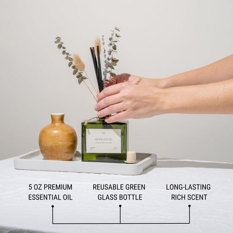 Craft and Kin green glass diffuser showcases elegant home fragrance.