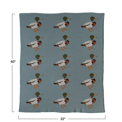 Creative Co-Op baby blanket on rocking chair creates a cozy accent.