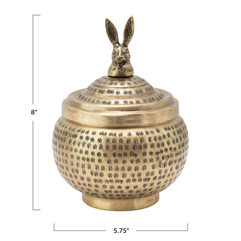 Creative Co-Op brass finish rabbit-lid container adds whimsical charm to shelves.