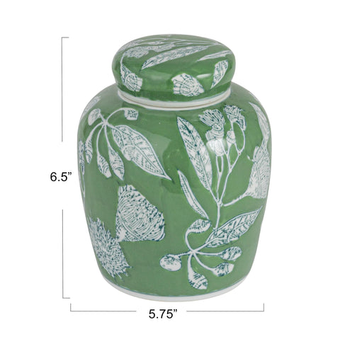 Creative Co-Op ginger jar close-up reveals green and white glaze with floral pattern.