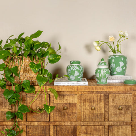 Creative Co-Op ginger jar on a shelf completes a curated display.