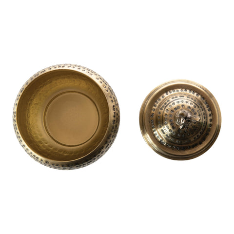 Creative Co-Op hammered texture detail on rabbit-finial lid highlights durable metal construction.