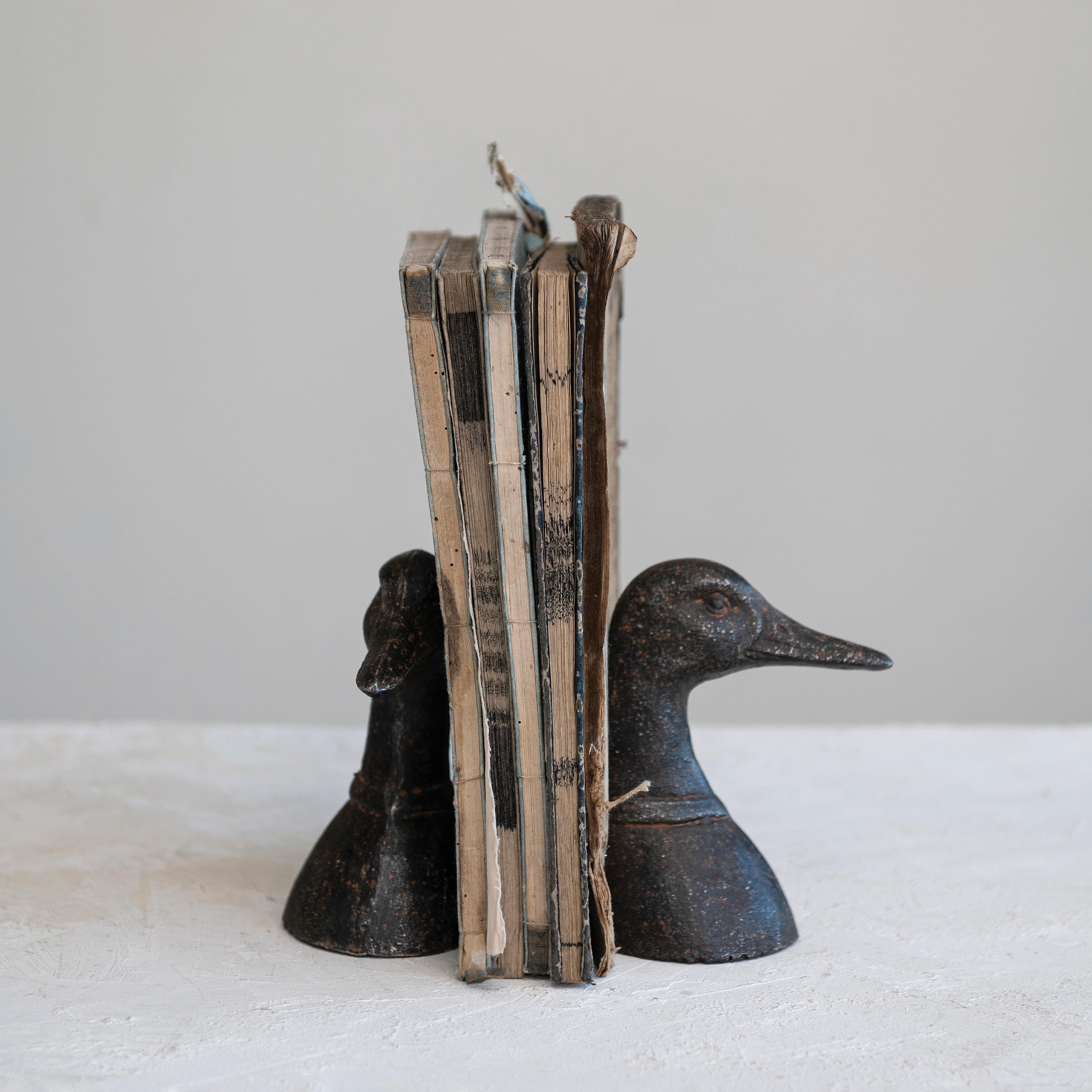 Creative Co-Op heavy metal bookend duck head supports varied book sizes