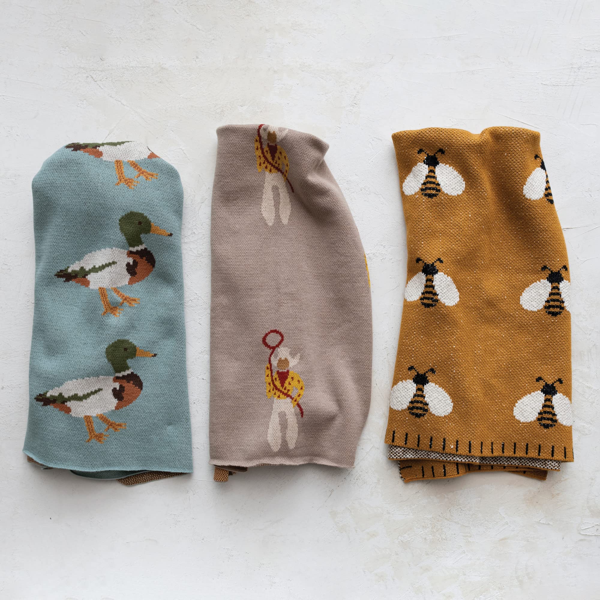 Creative Co-Op knitted cotton blanket close-up shows texture and print.