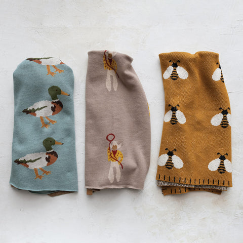 Creative Co-Op knitted cotton blanket close-up shows texture and print.