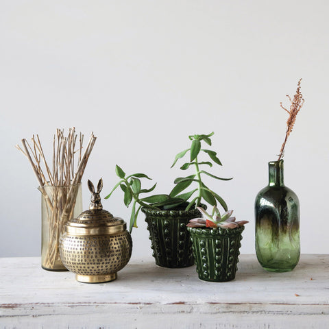 Creative Co-Op mantel display blends farmhouse and cottage vibes.